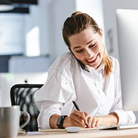 Woman smiling while working in office