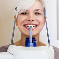 Woman receiving 3D CT dental x-ray scan