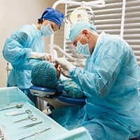 Dental team carefully working on patient