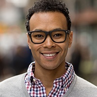 Man sharing smile after porcelain veneer placement