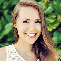 Woman sharing smile after gum recontouring