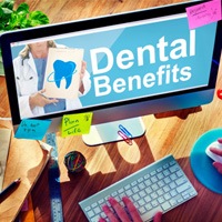 A dental patient researching dental insurance online 