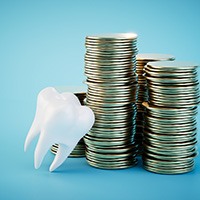 A 3D-rendered tooth leaning against stacks of coins