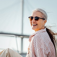 Woman with sunglasses on boat