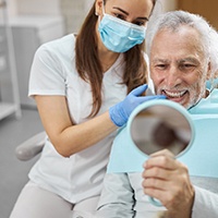 An older man enjoying his new dental implants