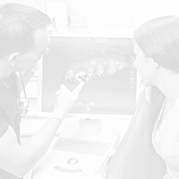 Dentist and patient looking at dental x-rays