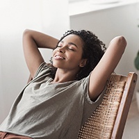 a woman relaxing due to oral conscious sedation