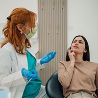 Concerned patient talking with her dentist