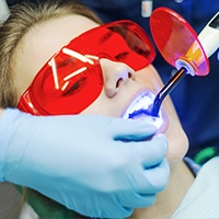 Patient receiving dental sealants