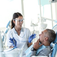 Patient asking dentist in Covington, GA questions about routine checkups.
