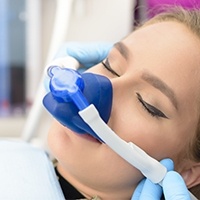 Woman with nitroux oxide dental sedation mask