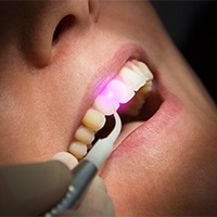 Patient receiving laser dentistry
