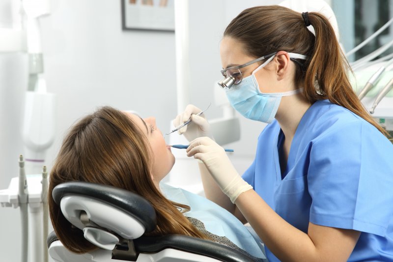 dental hygienist in Covington working on patient’s teeth