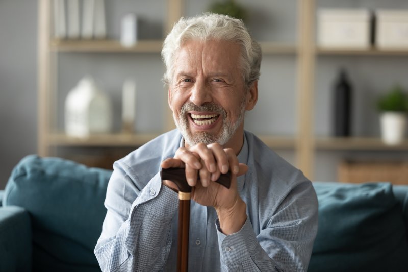 man smiling with dentures in Covington