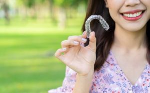 Closeup of smiling patient with clear aligners in Covington