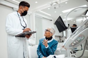 Patient asking questions during her dental implant consultation.