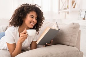 a woman enjoying a cup of coffee