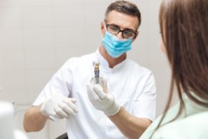 Dentist discussing dental implants with patient