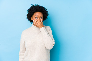 person with gingivitis covering mouth